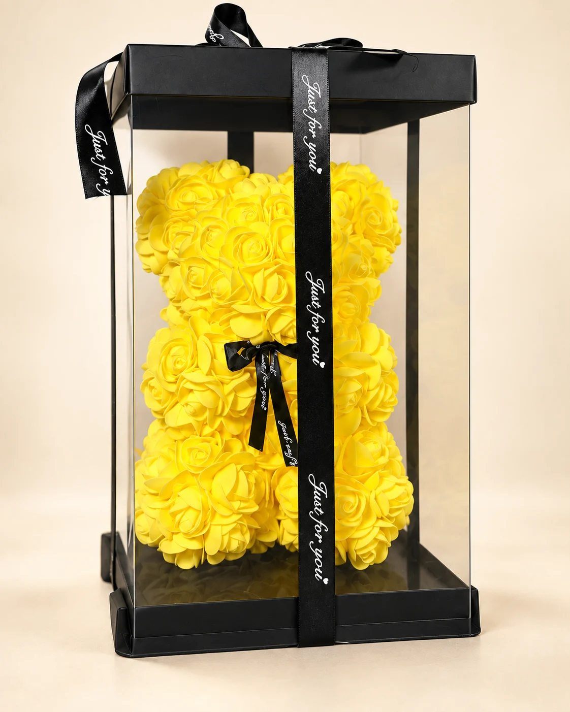 Oso teddy de rosas amarillas en caja transparente con cinta negra