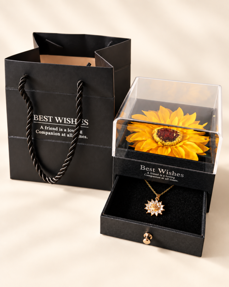 Joyero con girasol decorativo y collar floral acompañado de bolsa negra