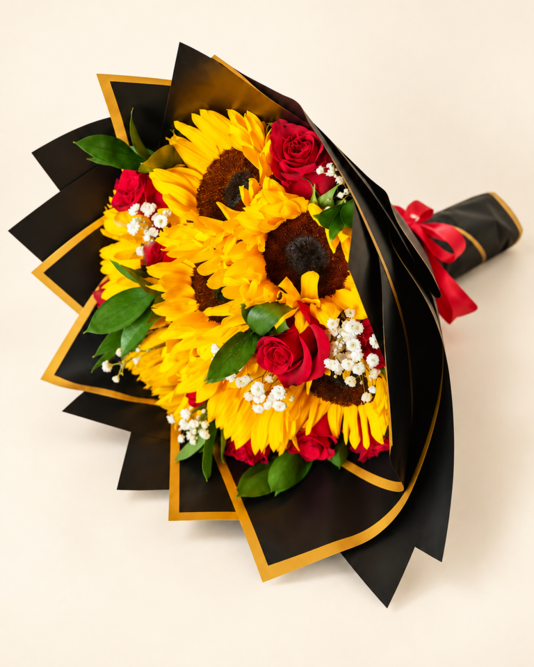 Bouquet de girasoles y rosas rojas con envoltura negra de bordes dorados