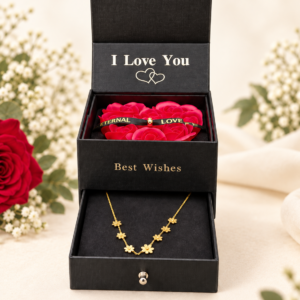 Joyero negro con rosas rojas y collar de flores en cajón